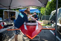 Quinn Barone, 16, completes final checks on Javelin 2.0 before a race run at the 2025 International Submarine Races. He and his father designed and built the sub at home in Annapolis, Maryland. Carderock, the Navy's ship design and innovation powerhouse, provides the technical foundation for the future fleet through world-class research, development, and testing. (U.S. Navy photo by Travis Troller)