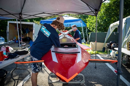 Quinn Barone, 16, completes final checks on Javelin 2.0 before a race run at the 2025 International Submarine Races. He and his father designed and built the sub at home in Annapolis, Maryland. Carderock, the Navy's ship design and innovation powerhouse, provides the technical foundation for the future fleet through world-class research, development, and testing. (U.S. Navy photo by Travis Troller)