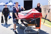 From left: Elizabeth, Zane, and Quinn Barone return Javelin 2.0 to their pit area after a successful run during the 2025 International Submarine Races. The Annapolis-based family competed as the only independent team in this year’s race. Carderock, the Navy's ship design and innovation powerhouse, provides the technical foundation for the future fleet through world-class research, development, and testing. (U.S. Navy photo by Kristin Behrle)