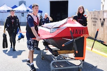 From left: Elizabeth, Zane, and Quinn Barone return Javelin 2.0 to their pit area after a successful run during the 2025 International Submarine Races. The Annapolis-based family competed as the only independent team in this year’s race. Carderock, the Navy's ship design and innovation powerhouse, provides the technical foundation for the future fleet through world-class research, development, and testing. (U.S. Navy photo by Kristin Behrle)