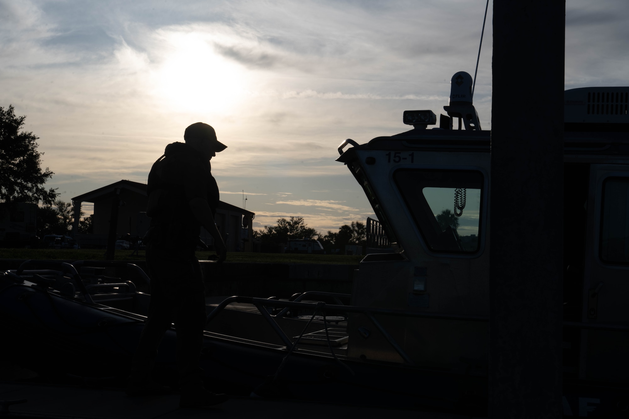U.S. Air Force Staff Sgt. Jason Kshir, 6th Security Forces marine patrolman, prepares to board a vessel at MacDill Air Force Base, Florida, June 26, 2025. The 6th SFS Marine Patrol unit is responsible for protecting one of the largest coastal restricted areas in the Department of Defense. (U.S. Air Force photo by Staff Sgt. Christopher Tam)
