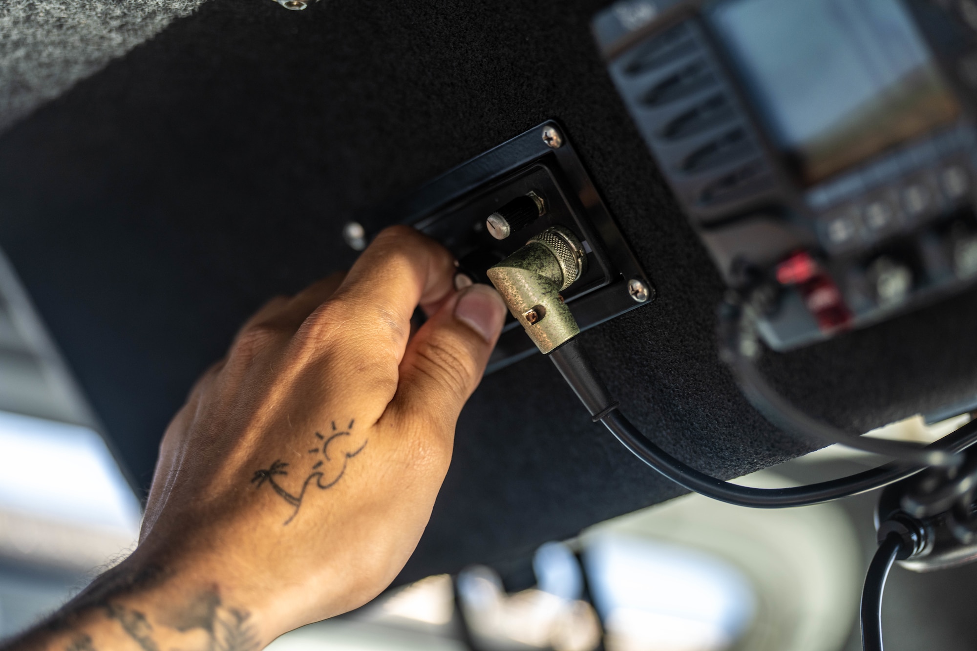 U.S. Air Force Senior Airman Justin Davis, 6th Security Forces marine patrolman, performs a radio check at MacDill Air Force Base, Florida, June 26, 2025. Marine patrol responds to incidents requiring water rescue and works in conjunction with the U.S. Coast Guard, Florida Wildlife Commission and local police agencies. (U.S. Air Force photo by Staff Sgt. Christopher Tam)