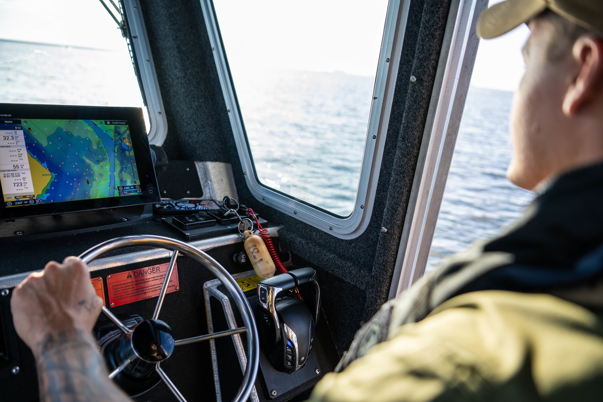 U.S. Air Force Senior Airman Justin Davis, 6th Security Forces marine patrolman, follows a global positioning system at MacDill Air Force Base, Florida, June 26, 2025. Marine patrol sees higher activity in the summer when vessels are more likely to travel along MacDill’s coastline. (U.S. Air Force photo by Staff Sgt. Christopher Tam)