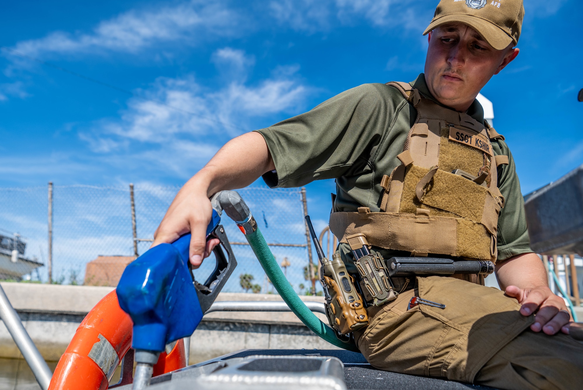 U.S. Air Force Staff Sgt. Jason Kshir, 6th Security Forces marine patrolman, pumps gas into a vessel at MacDill Air Force Base, Florida, June 26, 2025. In addition to securing MacDill’s 7.2-mile coastline, marine patrol conducts detection and surveillance of any suspicious vessels and ensures neutralization of any possible threats. (U.S. Air Force photo by Staff Sgt. Christopher Tam)