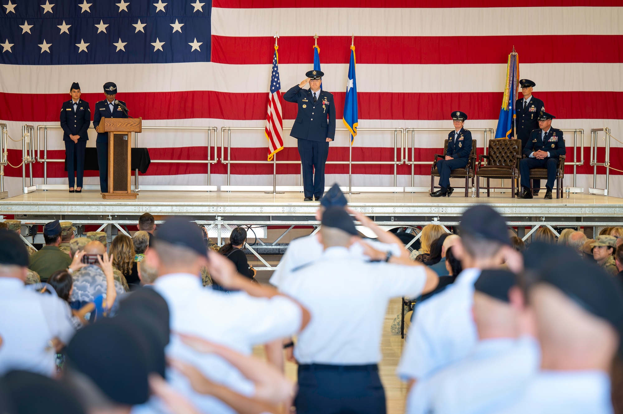 Man saluting members of the 377th air base wing