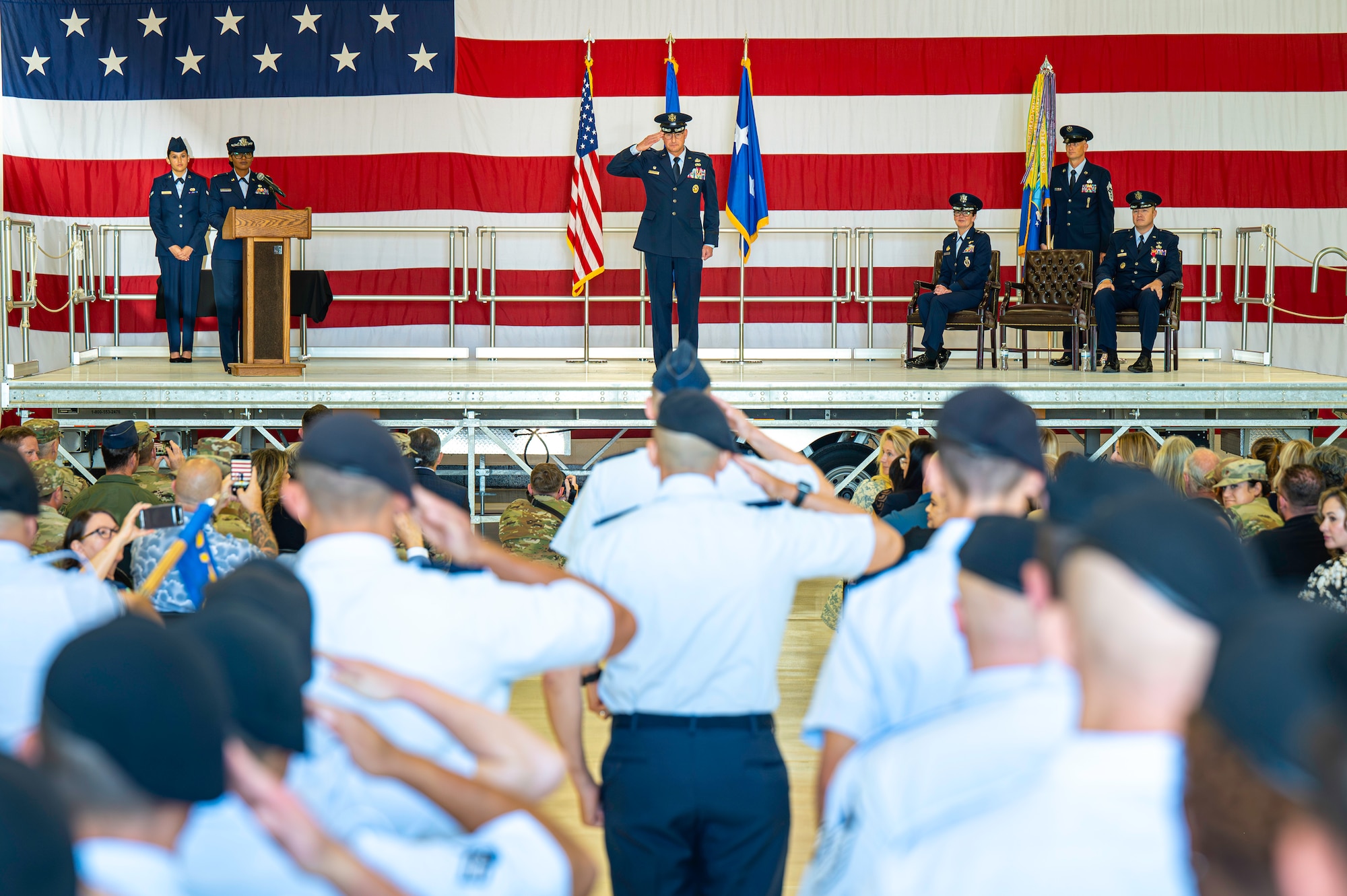 Man saluting members of the 377th air base wing