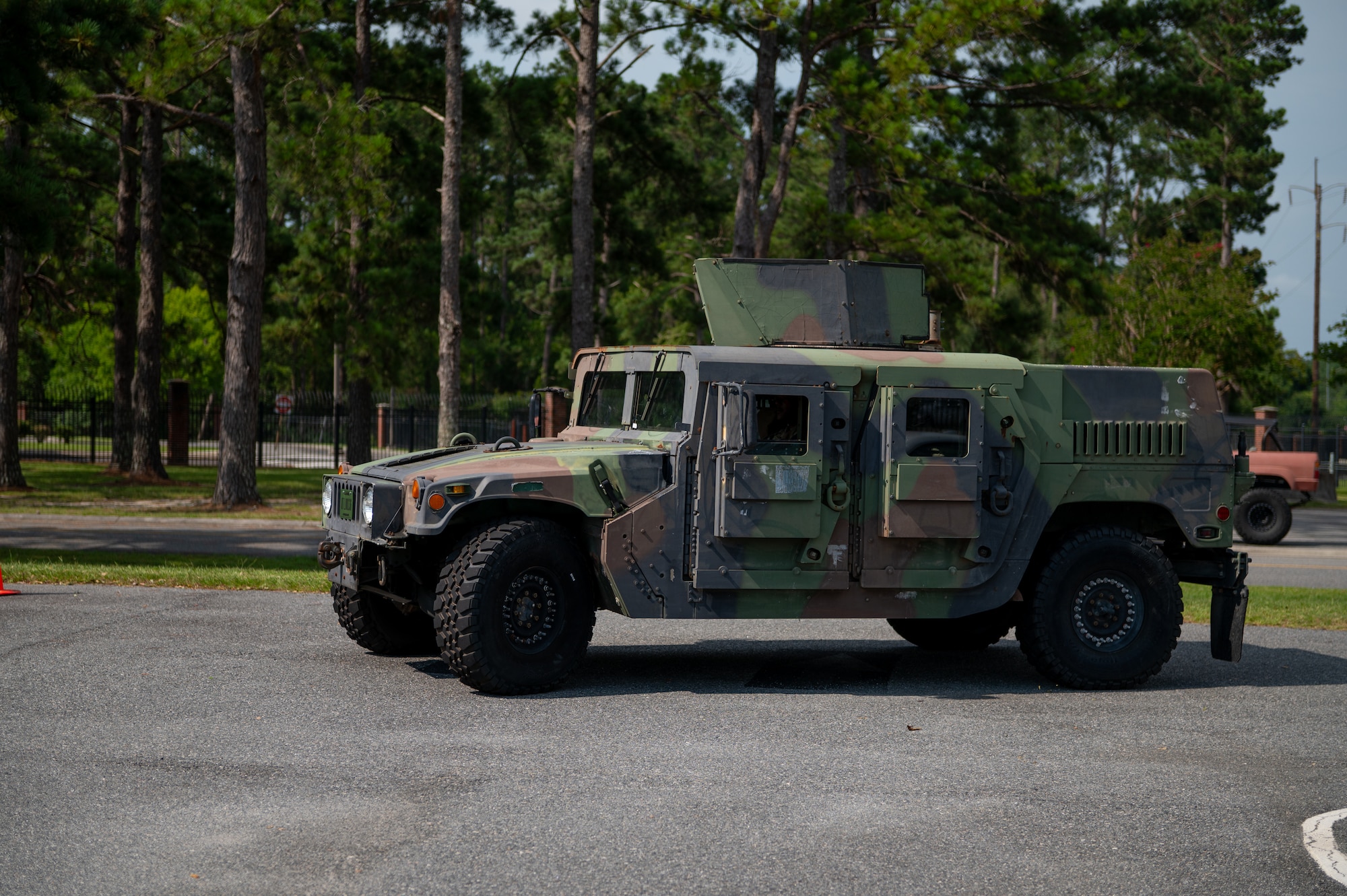 A vehicle drives around a parking lot.