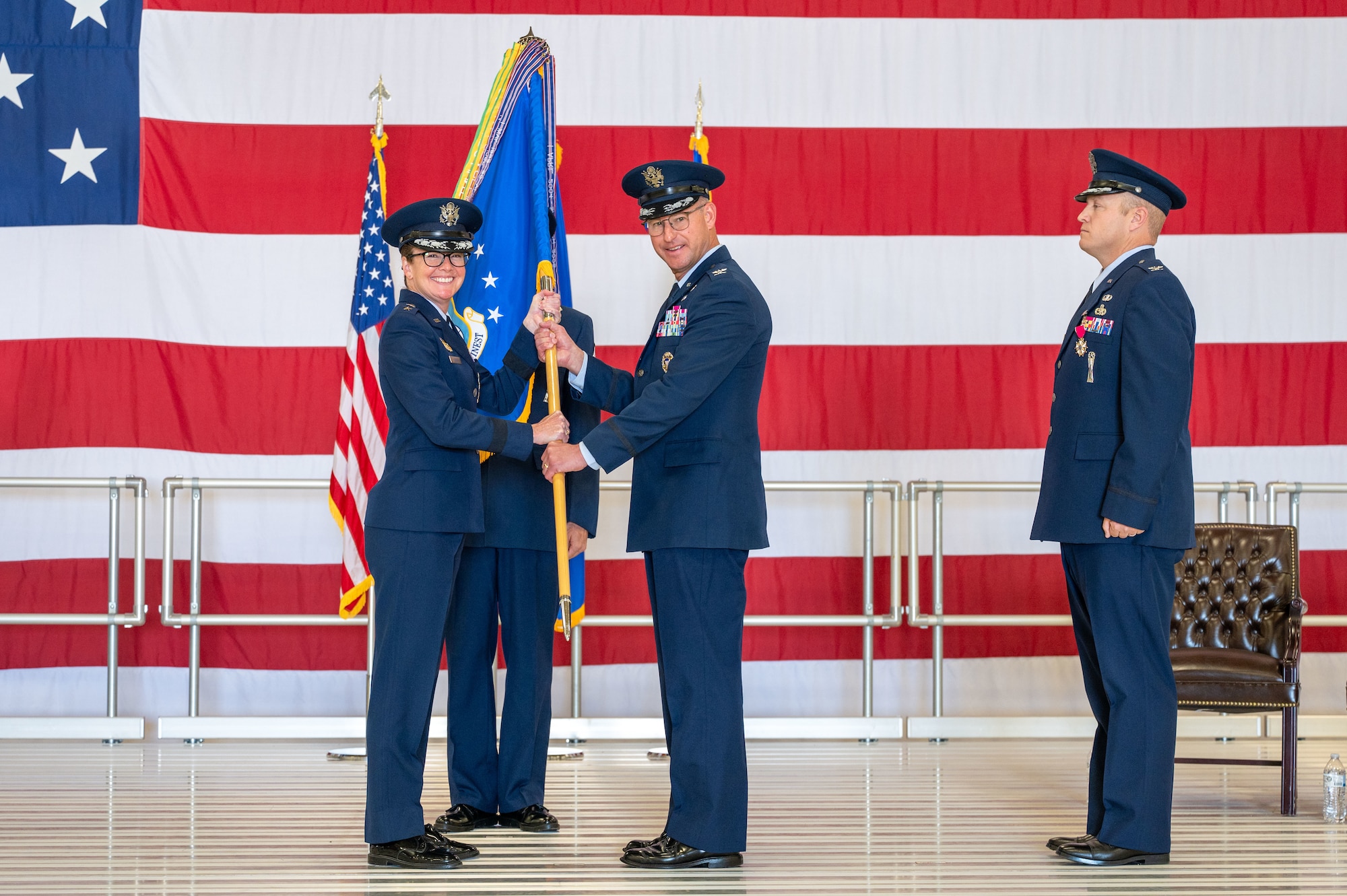 Woman handing over a flag to a man