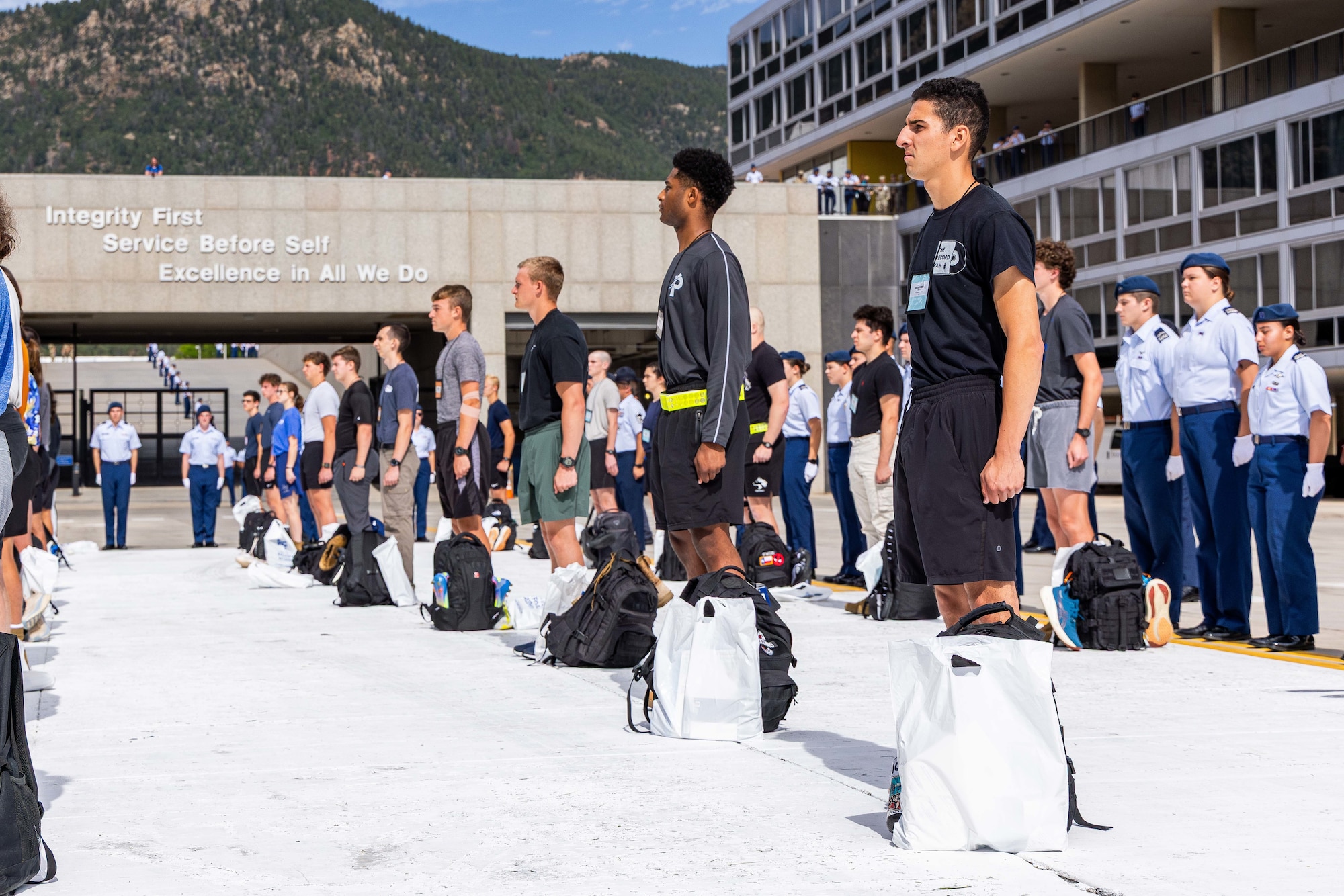 Photo of people standing at attention