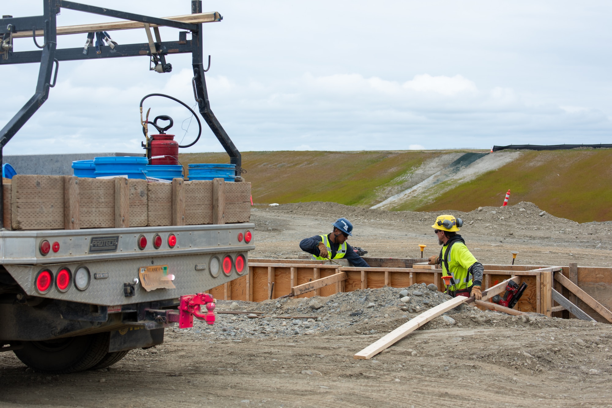 The Kiewit Construction Team continues to work on the expansion of the flight-line on Joint Base Elmendorf-Richardson, Alaska, June 30. This project began in the fall of 2022 and the team continues to make great efforts to complete it. One of two on Elmendorf Field, Runway 16/34 will be extended 2,900 feet to make the length of the runway 10,000 feet and the southern threshold of the runway will shift 400 feet to the north to meet airfield design requirements. The project will also extend the two parallel taxiways; add an arm-disarm pad; upgrade the airfield lighting and the instrument landing system; re-route Airlifter Drive around the north end of the extension; relocate airfield perimeter fencing and reconfigure utility services in the area. Upon completion of the runway extension, JBER will be capable of accommodating any airframe in the Department of Defense, regardless of the weather.