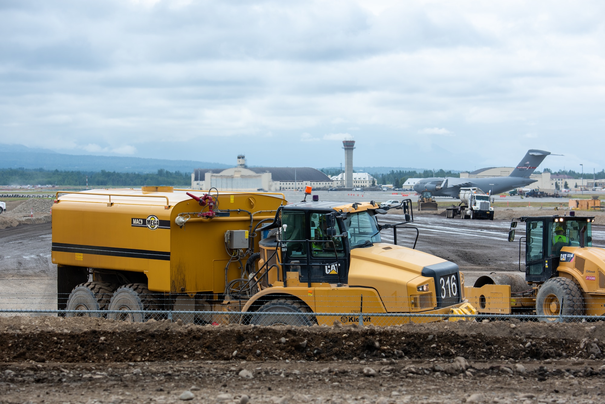 The Kiewit Construction Team continues to work on the expansion of the flight-line on Joint Base Elmendorf-Richardson, Alaska, June 30. This project began in the fall of 2022 and the team continues to make great efforts to complete it. One of two on Elmendorf Field, Runway 16/34 will be extended 2,900 feet to make the length of the runway 10,000 feet and the southern threshold of the runway will shift 400 feet to the north to meet airfield design requirements. The project will also extend the two parallel taxiways; add an arm-disarm pad; upgrade the airfield lighting and the instrument landing system; re-route Airlifter Drive around the north end of the extension; relocate airfield perimeter fencing and reconfigure utility services in the area. Upon completion of the runway extension, JBER will be capable of accommodating any airframe in the Department of Defense, regardless of the weather.