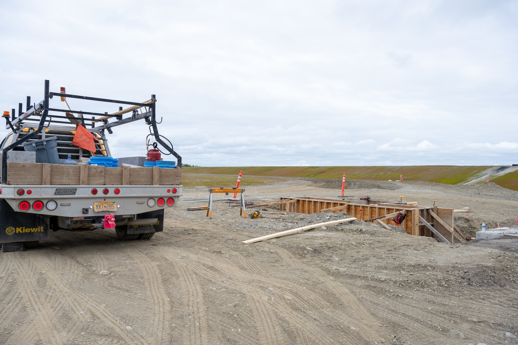 The Kiewit Construction Team continues to work on the expansion of the flight-line on Joint Base Elmendorf-Richardson, Alaska, June 30. This project began in the fall of 2022 and the team continues to make great efforts to complete it. One of two on Elmendorf Field, Runway 16/34 will be extended 2,900 feet to make the length of the runway 10,000 feet and the southern threshold of the runway will shift 400 feet to the north to meet airfield design requirements. The project will also extend the two parallel taxiways; add an arm-disarm pad; upgrade the airfield lighting and the instrument landing system; re-route Airlifter Drive around the north end of the extension; relocate airfield perimeter fencing and reconfigure utility services in the area. Upon completion of the runway extension, JBER will be capable of accommodating any airframe in the Department of Defense, regardless of the weather.