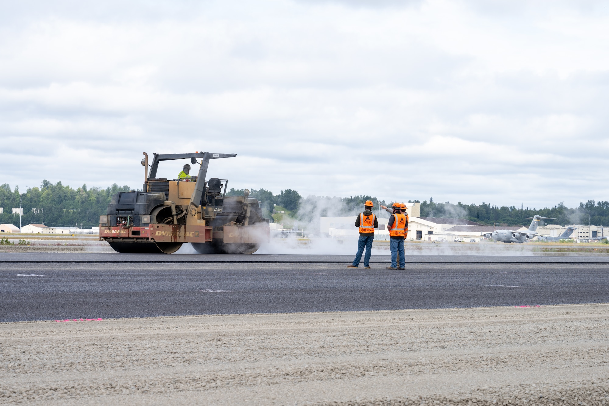 The Kiewit Construction Team continues to work on the expansion of the flight-line on Joint Base Elmendorf-Richardson, Alaska, June 30. This project began in the fall of 2022 and the team continues to make great efforts to complete it. One of two on Elmendorf Field, Runway 16/34 will be extended 2,900 feet to make the length of the runway 10,000 feet and the southern threshold of the runway will shift 400 feet to the north to meet airfield design requirements. The project will also extend the two parallel taxiways; add an arm-disarm pad; upgrade the airfield lighting and the instrument landing system; re-route Airlifter Drive around the north end of the extension; relocate airfield perimeter fencing and reconfigure utility services in the area. Upon completion of the runway extension, JBER will be capable of accommodating any airframe in the Department of Defense, regardless of the weather.