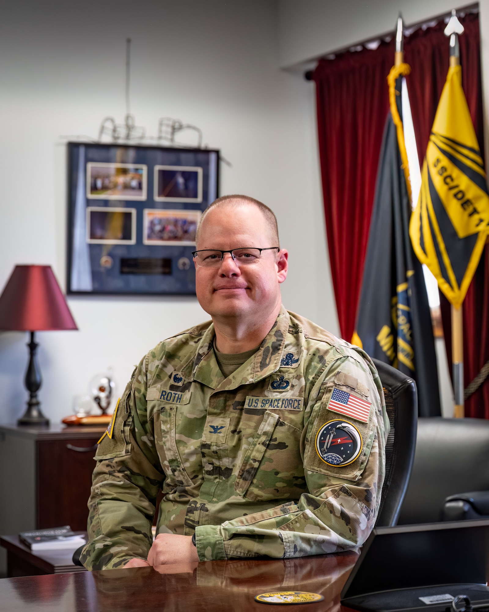 Man in military uniform at desk