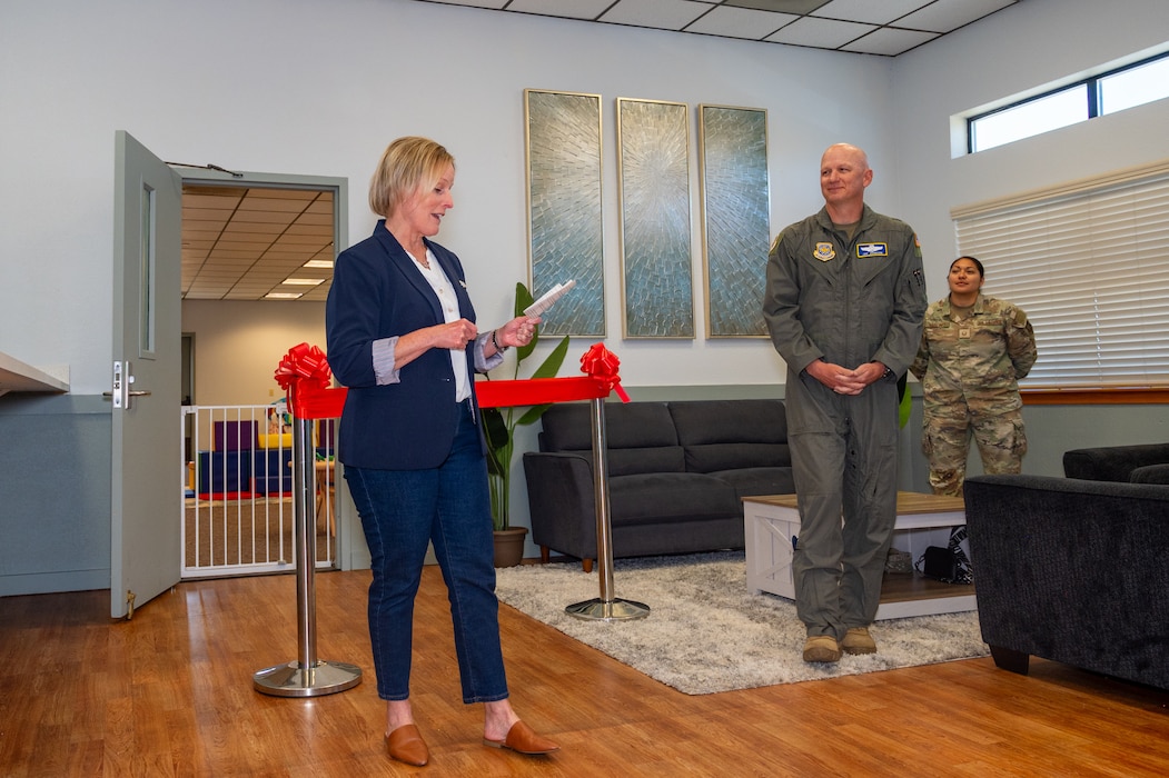 Wing commander and his wife deliver opening remarks at ribbon cutting