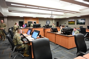 Members of Headquarters Air Reserve Personnel Center Promotion Board team conduct operations during a mock board on Buckley Space Force Base, Colo., May 28, 2025. Comprised of enlisted and officer Airmen, civilians and contractors, the team supports the full lifecycle of officer promotion boards across the Air Force Reserve and Air National Guard. (U.S. Air Force photo/Tech. Sgt. Cory Payne)