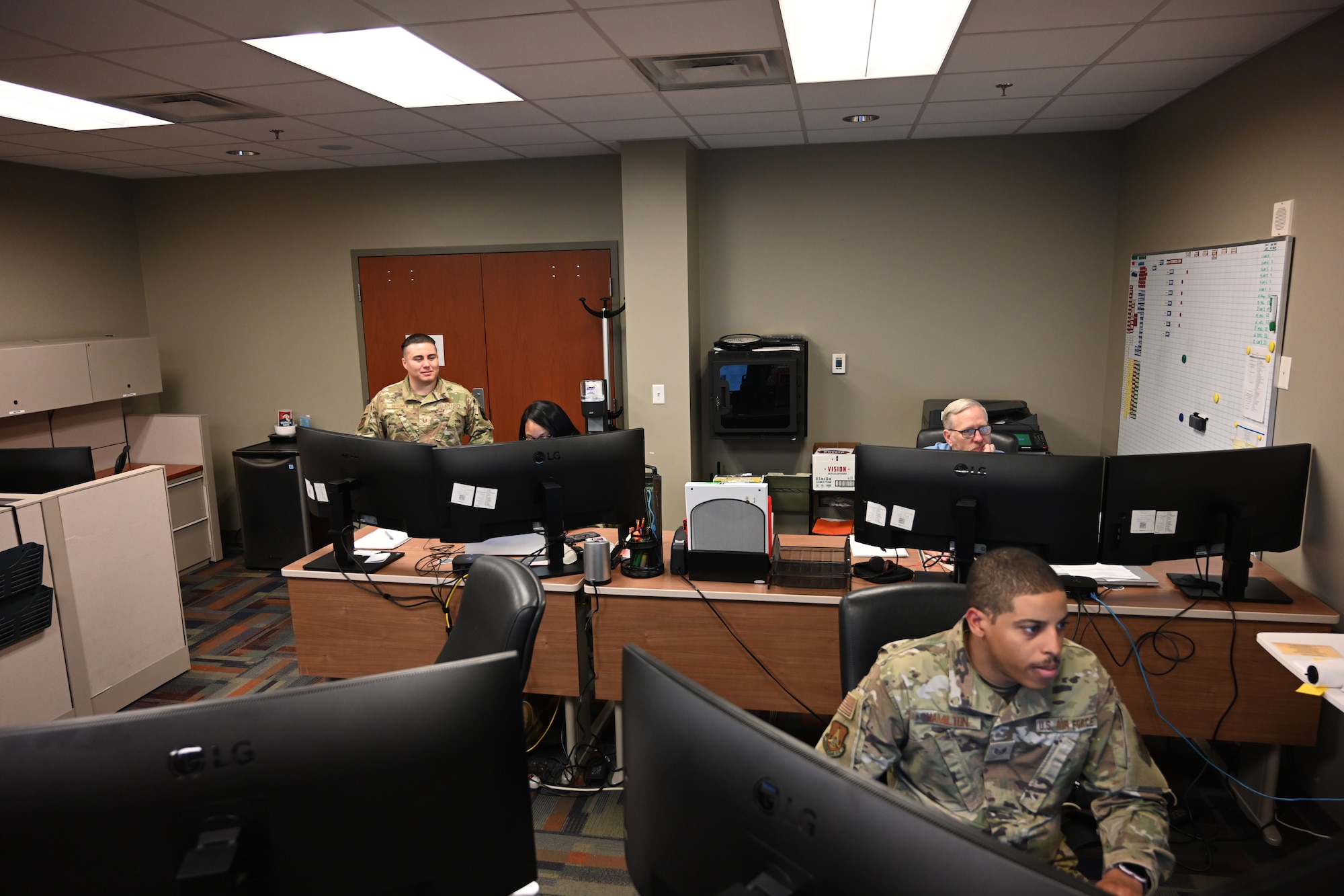 Members of Headquarters Air Reserve Personnel Center Promotion Board team conduct operations during a mock board on Buckley Space Force Base, Colo., May 28, 2025. Comprised of enlisted and officer Airmen, civilians and contractors, the team supports the full lifecycle of officer promotion boards across the Air Force Reserve and Air National Guard. (U.S. Air Force photo/Tech. Sgt. Cory Payne)