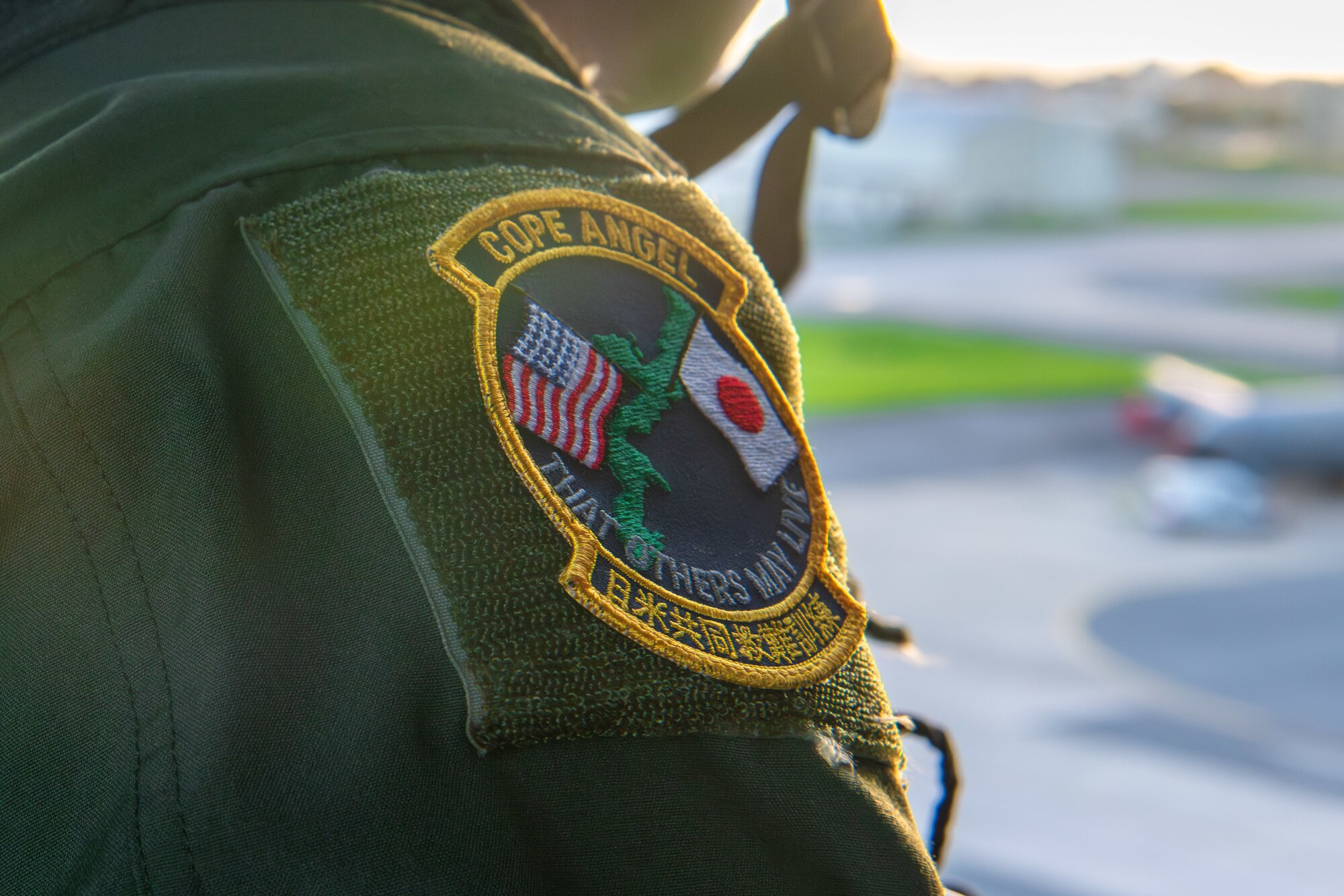 A Cope Angel patch on the shoulder of a flight suite