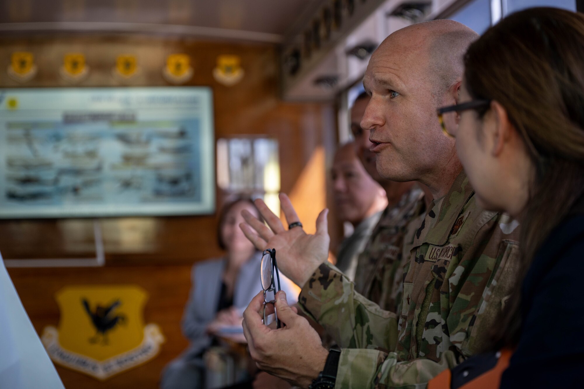 U.S. Air Force Brig. Gen. Nicholas Evans, 18th Wing commander, delivers a brief to Honorable Gen Nakatani, Japan's Minister of Defense, during Nakatani’s visit to Kadena Air Base, Japan, June 23, 2025.