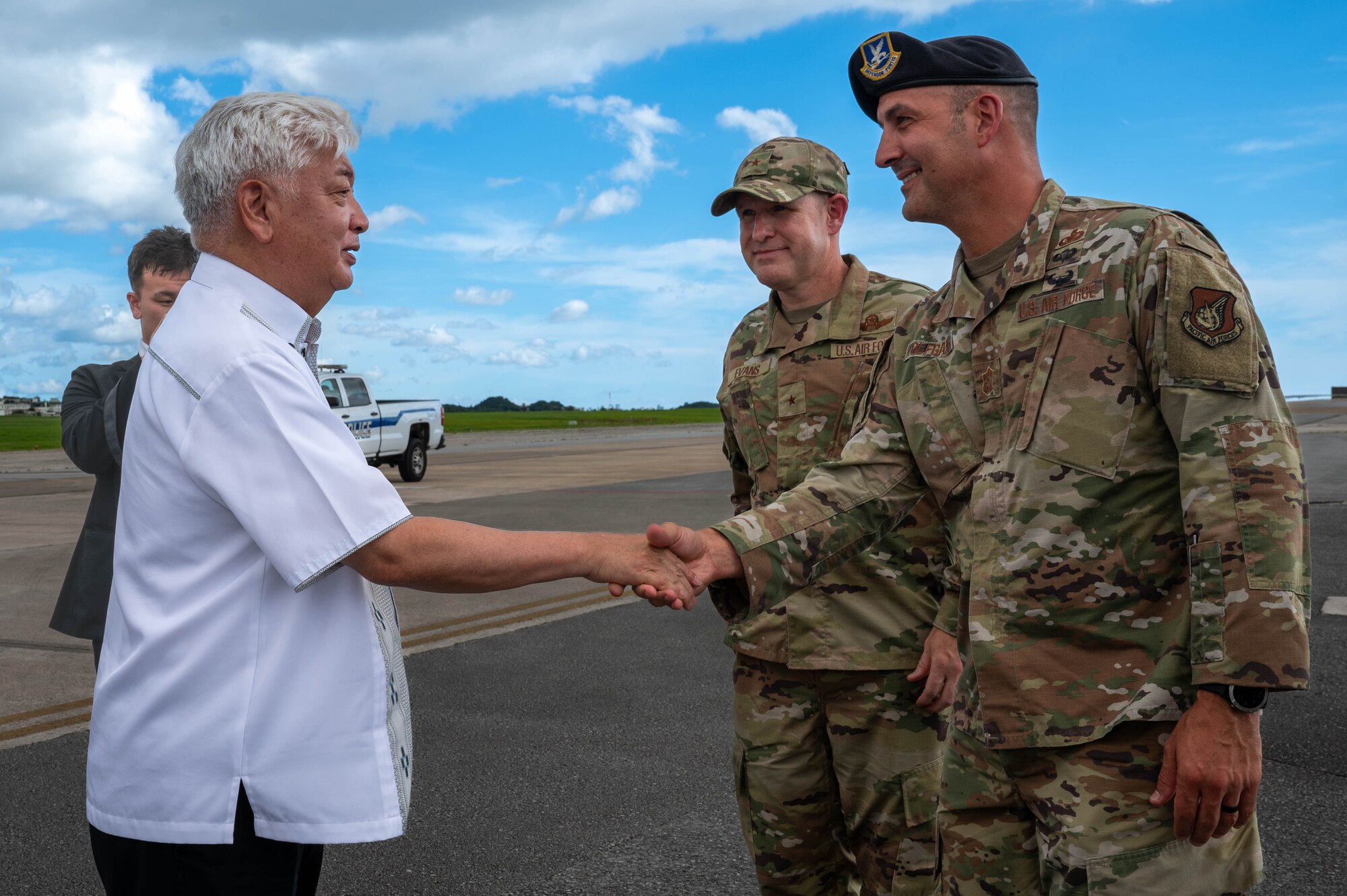 Honorable Gen Nakatani, left, Japan's Minister of Defense, bids farewell to U.S. Air Force Brig. Gen. Nicholas Evans, center right, 18th Wing commander, and Chief Master Sgt. Brandon Wolfgang, 18th Wing command chief, at Kadena Air Base, Japan, June 23, 2025.
