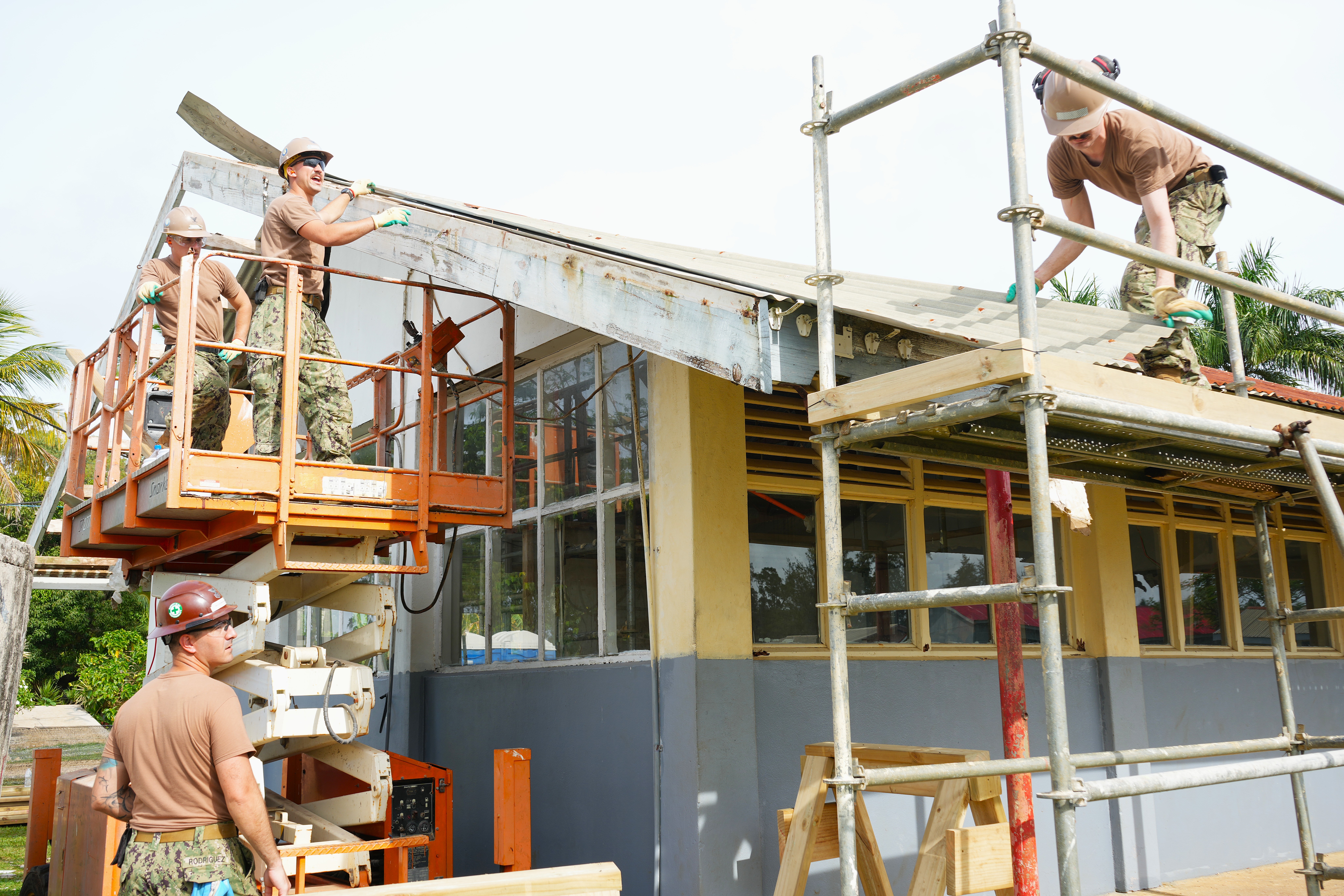 U.S. Navy Sailors, assigned to Naval Mobile Construction Battalion 4, remove obsolete roof shingles during facility renovations at Tonga College ‘Atele as part of PP-25 in Nuku’Alofa, Tonga, June 23, 2025.