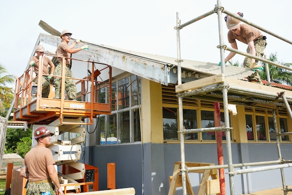 U.S. Navy Sailors, assigned to Naval Mobile Construction Battalion 4, remove obsolete roof shingles during facility renovations at Tonga College ‘Atele as part of PP-25 in Nuku’Alofa, Tonga, June 23, 2025.