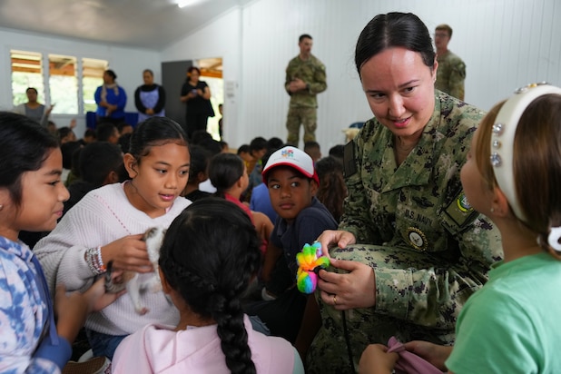 U.S. Navy Cmdr. Krystal Chunaco, Director of Medical Operations with Pacific Partnership 2025 (PP-25), provides pet ownership and care lessons to the students of the Acts Community School during PP-25 in Nuku’Alofa, Tonga, June 25, 2025.