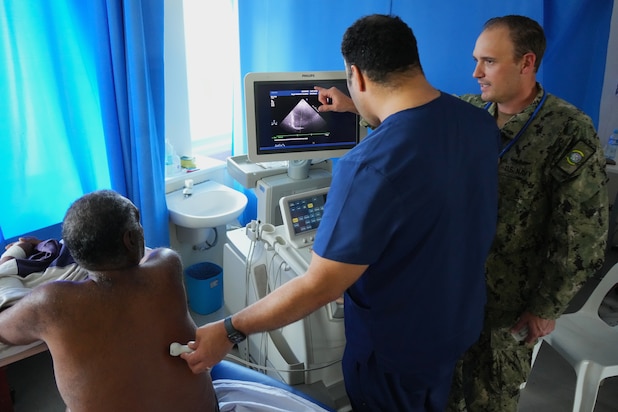 U.S. Navy Lt. Cmdr. Sean Foley, right, Critical Care Physician with Pacific Partnership 2025 (PP-25), assists Dr. Richard Taumoepeau, a local physician, during an ultrasound guided thoracentesis at Vaiola Hospital as part of PP-25 in Nuku’Alofa, Tonga, June 26, 2025.