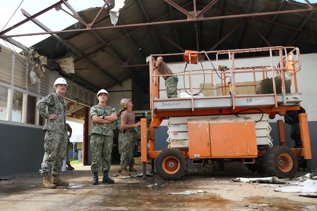 U.S. Navy Capt. Mark B. Stefanik, second from right, mission commander of Pacific Partnership 2025 (PP-25), tours the Tonga College ‘Atele campus as Naval Mobile Construction Battalion 4 lead engineering repairs as part of PP-25 in Nuku’Alofa, Tonga, June 26, 2025.
