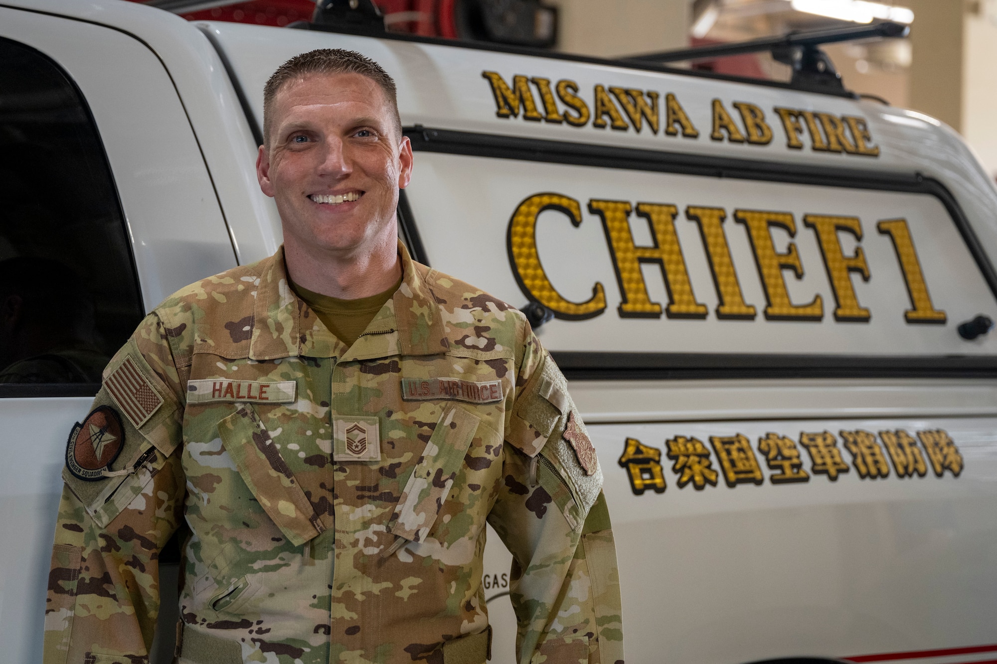 U.S. Air Force Senior Master Sgt. Roger Halle, 35th Civil Engineer Squadron fire chief, poses in front of his fire chief truck at Misawa Air Base, Japan, June 11, 2025.