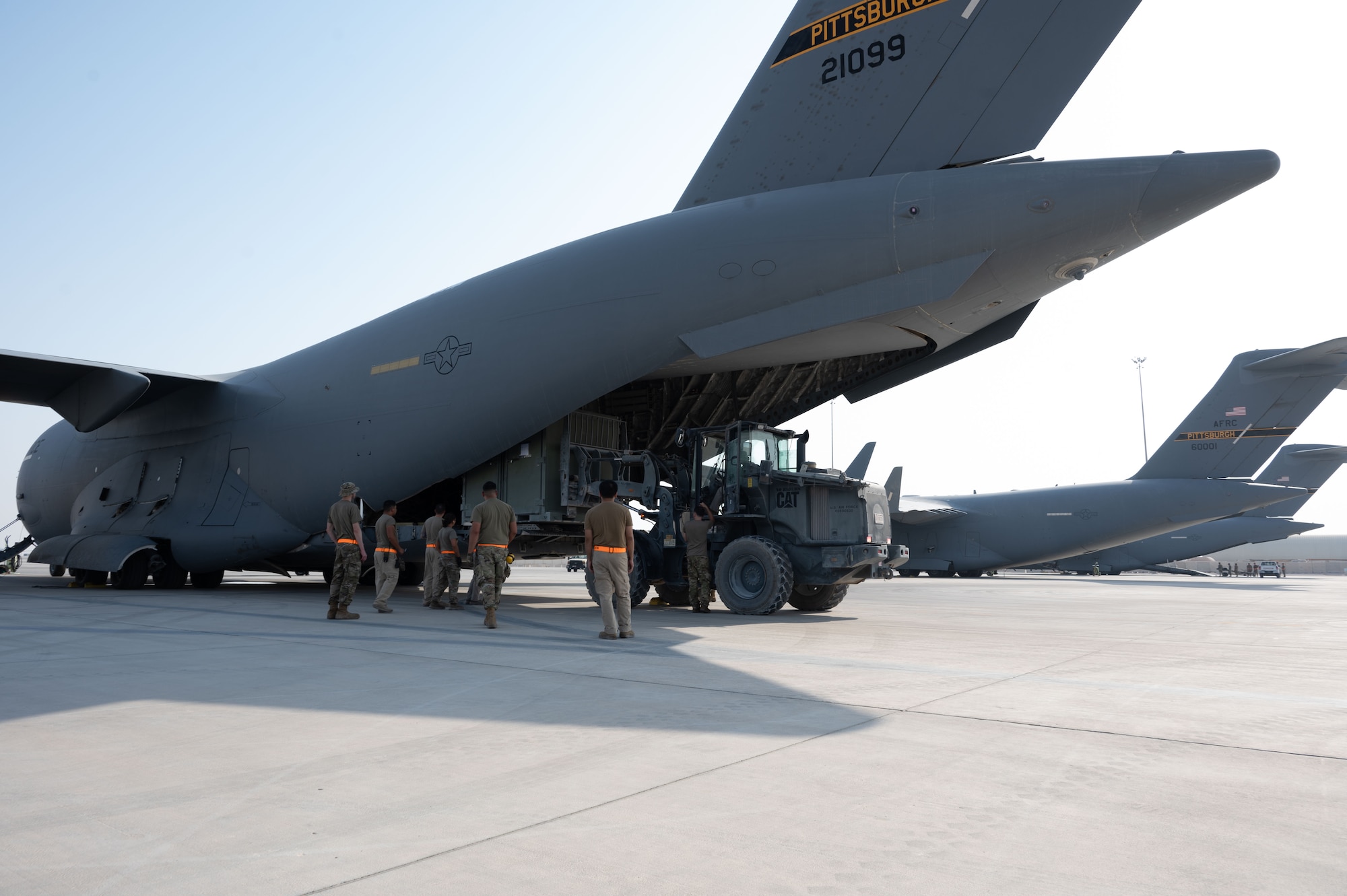 U.S. Air Force Airmen assigned to the 379th Expeditionary Air Base Group load cargo during a rapid aircraft departure within the U.S. Central Command area of responsibility, June 15, 2025. The 379th EABG accelerates readiness and embraces change to serve as a symbol for the future of Air Force deployed operations. (U.S. Air Force photo by Senior Airman Dieondiere Jefferies)