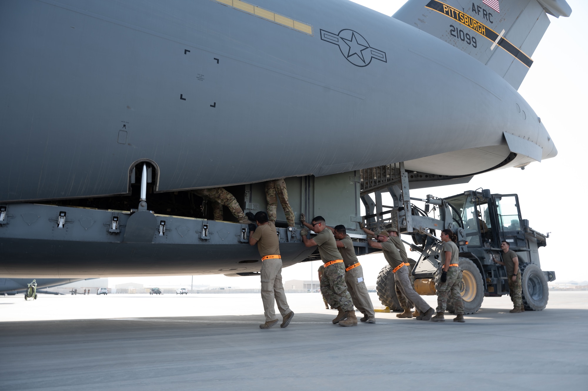 U.S. Air Force Airmen assigned to the 379th Expeditionary Air Base Group load cargo during a rapid aircraft departure within the U.S. Central Command area of responsibility, June 15, 2025. The 379th EABG accelerates readiness and embraces change to serve as a symbol for the future of Air Force deployed operations. (U.S. Air Force photo by Senior Airman Dieondiere Jefferies)