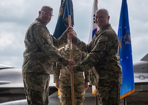 U.S. Air Force Maj. Jedidiah Rodgers, right, incoming 51st Maintenance Squadron commander, assumes command from Col. Kenneth Beebe, left, 51st Maintenance Group commander, during a Change of Command ceremony at Osan Air Base, Republic of Korea, July 2, 2025. Prior to assuming command, Rodgers commanded the 35th Maintenance Group Staff, 35th Fighter Wing, Misawa Air Base, Japan. (U.S. Air Force photo by Staff Sgt. Sarah Williams)