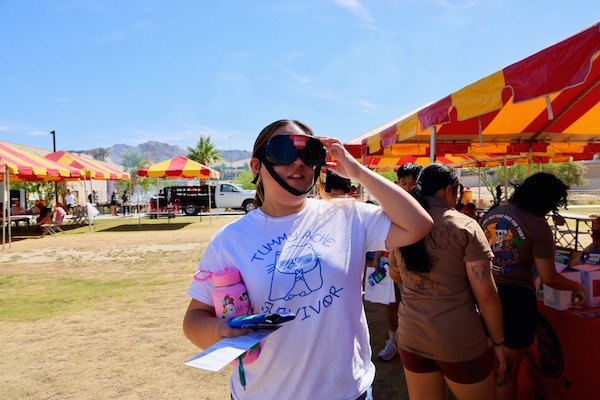 Sailors and staff at Naval Hospital Twentynine Palms participate in an interactive obstacle course while wearing impairment goggles during the 101 Days of Summer Safety Fair, held June 12, 2025, in Twentynine Palms, Calif. The annual event promotes seasonal safety awareness and injury prevention through hands-on activities, demonstrations, and educational outreach (U.S. Navy photo by Christopher C. Jones, NHTP/NMRTC Twentynine Palms public affairs officer).