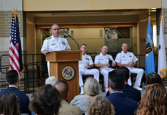 Read Admiral Robert J. Hawkins addresses the attendees at the Navy Medicine Readiness and Training Command Patuxent River  Change of Command on June 27, 2025, as Captain Jeremy J. Hawker, relinquished command to Captain Kennett “Ken” D. Radford. The ceremony marked the transition of leadership for the command which encompasses NMRTC Patuxent River, Navy Medicine and Readiness Training Unit (NMRTU) Dahlgren, NMRTC Detachment Indian Head, and NMRTC Detachment Joint Base Andrews. These locations provide essential medical support to over 90 tenant commands across the region. The Commanding Officer of NMRTC Patuxent River also serves as the Director for Naval Health Clinic Patuxent River and its branch clinics.