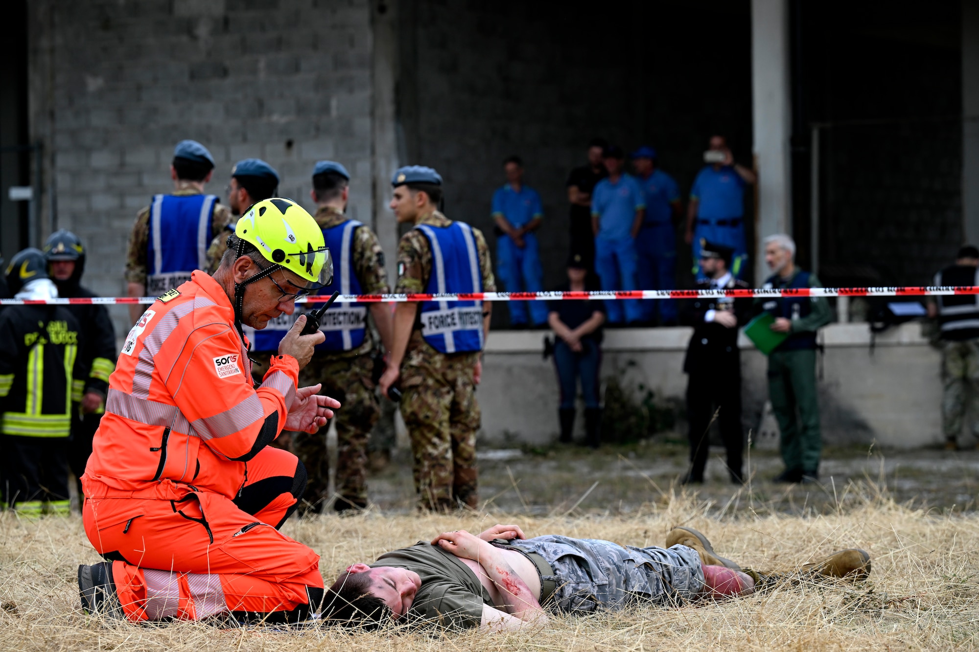 Italian first responder talks on a radio.