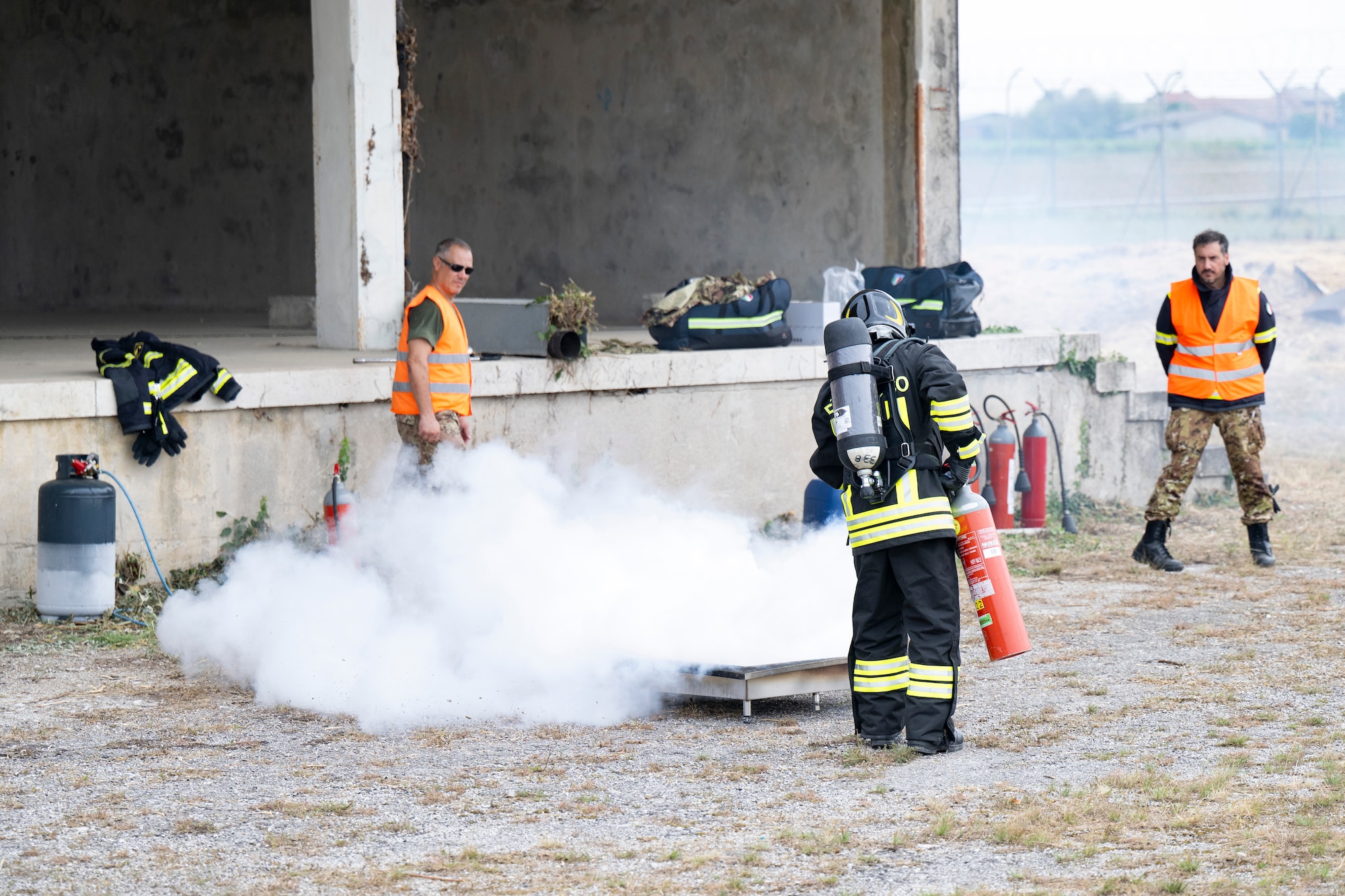 A firefighter extinguishes fire for an exercise