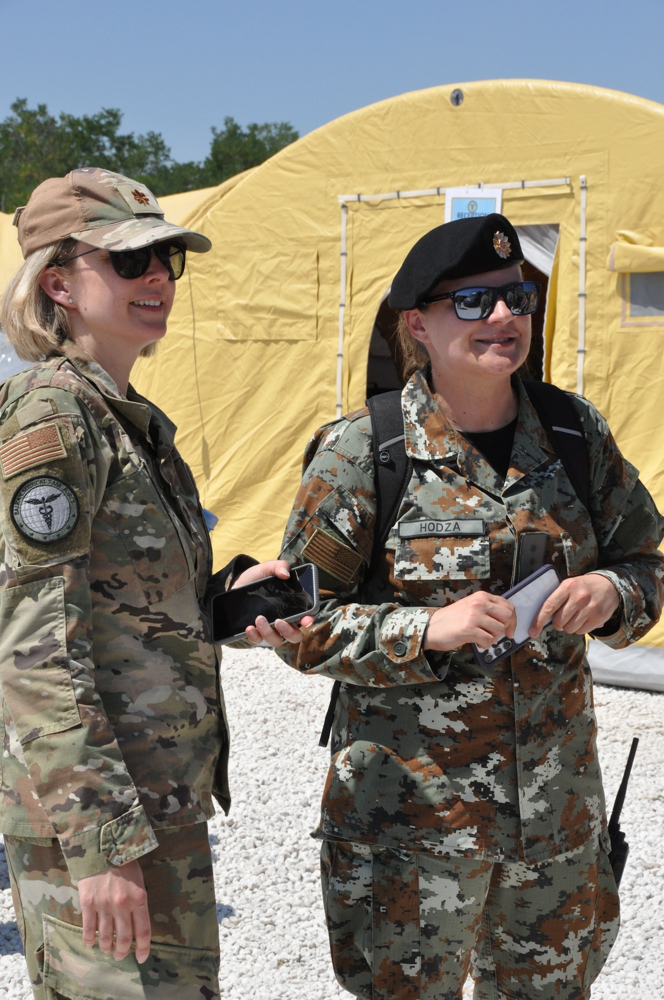 Two women in uniform standing next to each other.
