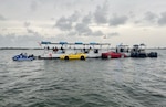 A charter vessel is shown during a safety boarding inspection