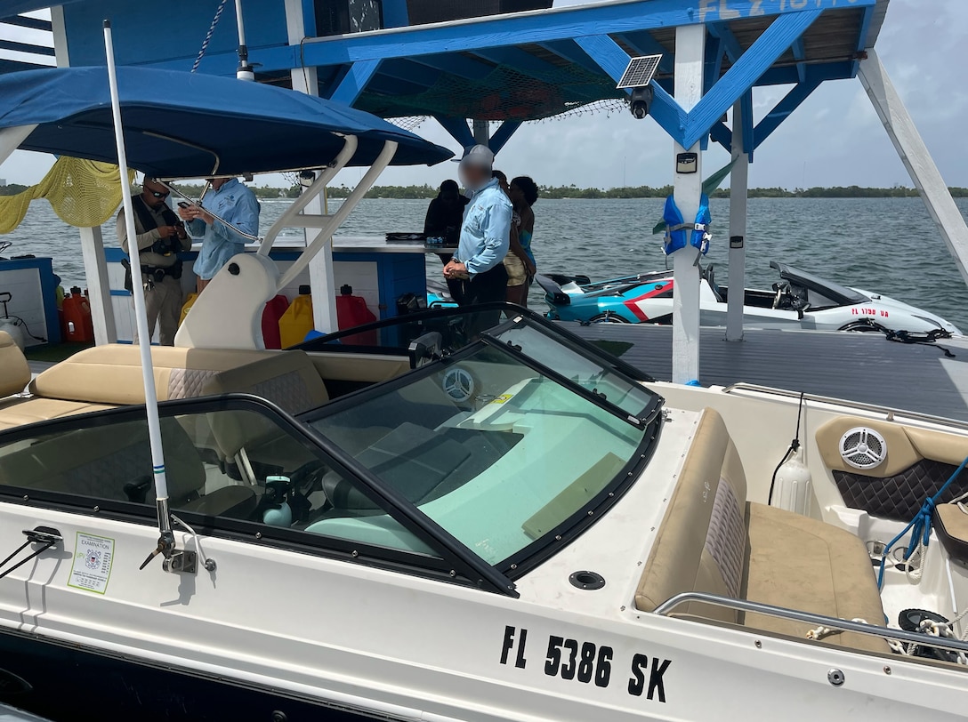 A Coast Guard boarding team inspects a charter vessel
