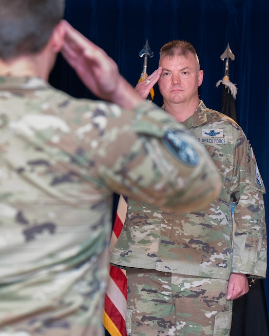  U.S. Space Force Col. Stephen Hobbs recieves his first salute as commander of Mission Delta 31 (MD 31) at a Change of Command Ceremony at Peterson Space Force Base, Colo., June 27, 2025. MD 31's first commander, Col. Andrew Menschner, handed the reigns over to Hobbs. MD 31 leads the United States Space Force's Positioning Navigation and Timing (Global Positioning System) and Satellite Control Network missions. (U.S. Space Force photo by Dave Grim)