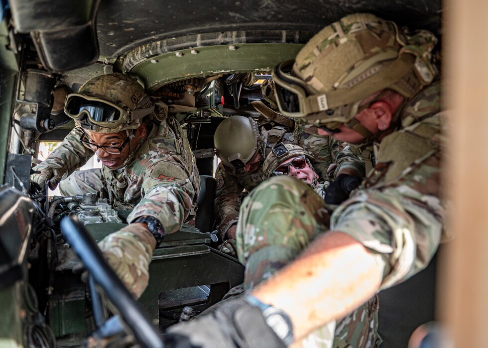 Airmen in humvee