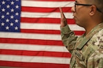 Army soldier swearing in at reenlistment ceremony
