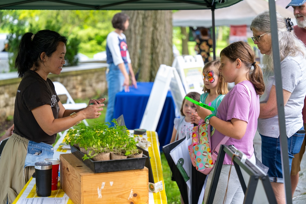 A member of the 88th Civil Engineer Group’s Environmental Branch greets guests attending the Pollinator Expo June 18, 2025, at the Wright Brothers Memorial, Dayton, Ohio. This is the fifth year of the Pollinator Expo which was started to bring awareness about the decline of pollinator populations. (U.S. Air Force photo by Jack Gardner)