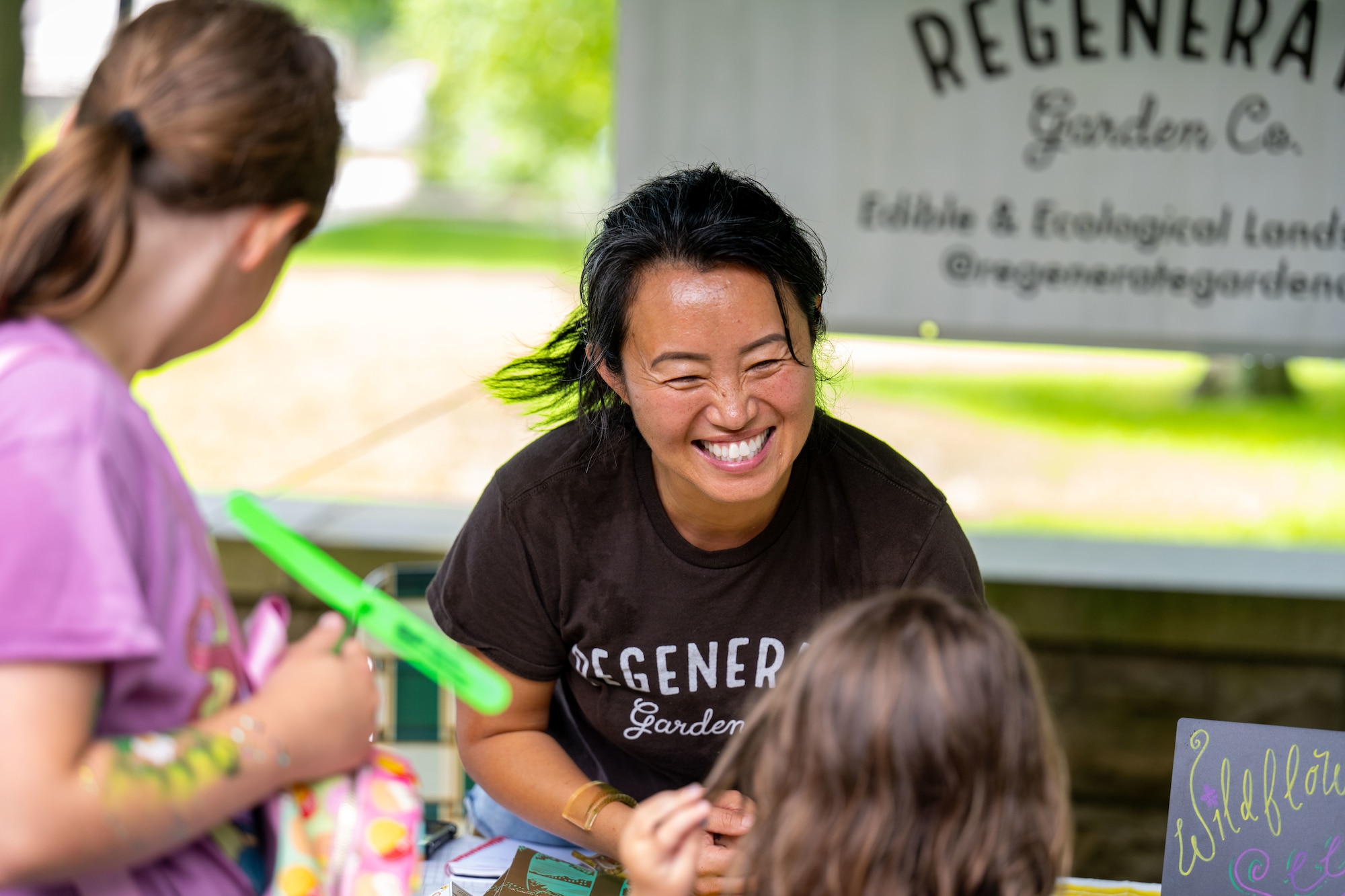 A vendor greets guests attending the Pollinator Expo June 18, 2025, at the Wright Brothers Memorial, Dayton, Ohio. This is the fifth year of the Pollinator Expo which was started to bring awareness about the decline of pollinator populations. (U.S. Air Force photo by Jack Gardner)