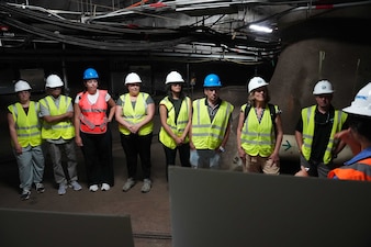 A Navy Closure Task Force-Red Hill (NCTF-RH) community liaison officer speaks with visitors from the National Academies of Sciences, Engineering, and Medicine during a site visit to the Red Hill Bulk Fuel Storage Facility (RHBFSF) in Honolulu, June 24, 2025. Charged with the safe decommissioning of the facility, NCTF-RH was established by the Department of the Navy as a commitment to the community and the environment. NCTF-RH continues to engage with the people of Hawaii, regulatory agencies, and other stakeholders as it safely and deliberately decommissions the RHBFSF. (U.S. Navy photo by Mass Communication Specialist 1st Class Glenn Slaughter)