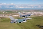 Two U.S. Air Force F-16 Fighting Falcons from the 120th Fighter Squadron, Colorado Air National Guard, fly past Denver International Airport during a photo chase mission around Denver, May 29, 2015. (U.S. Air National Guard photo by, Tech. Sgt. Wolfram M. Stumpf)(RELEASED)