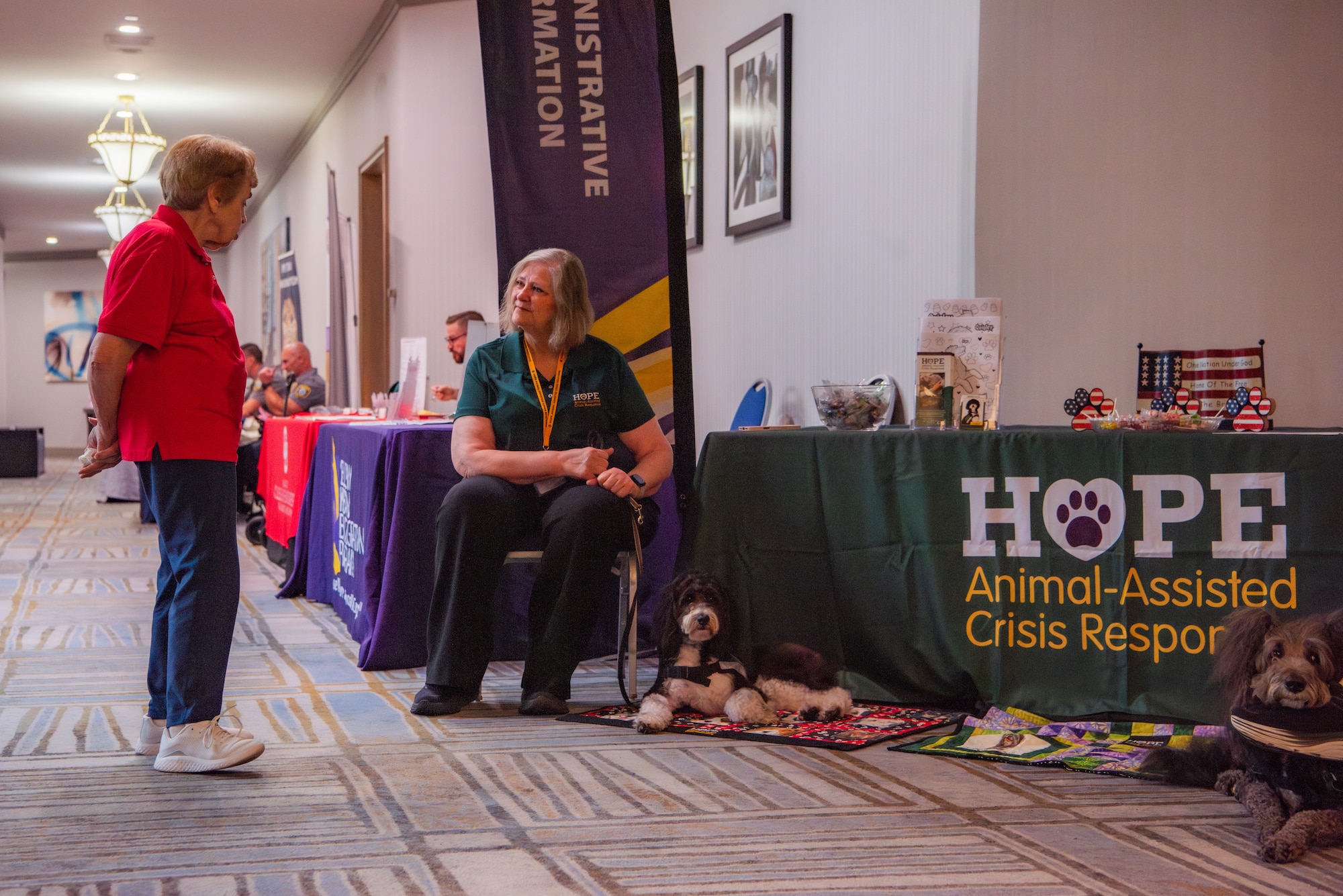 An attendee visits an event booth.