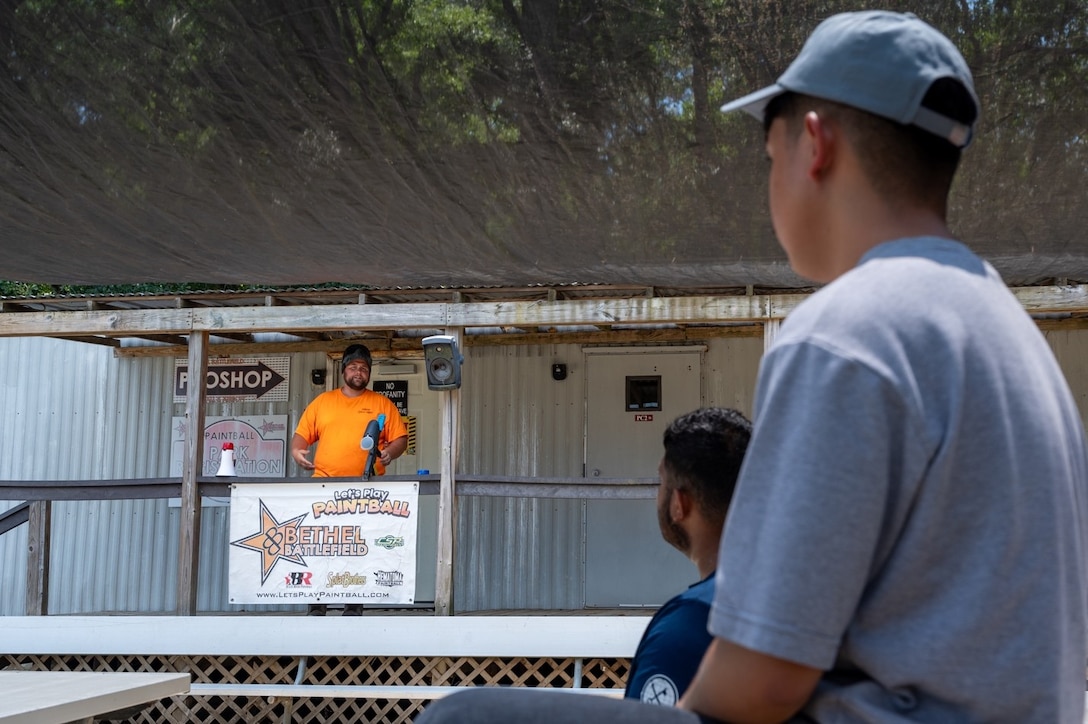 A man gives an equipment tutorial to Airmen. (U.S. Air Force photo by Airman 1st Class Donnell Ramsey)