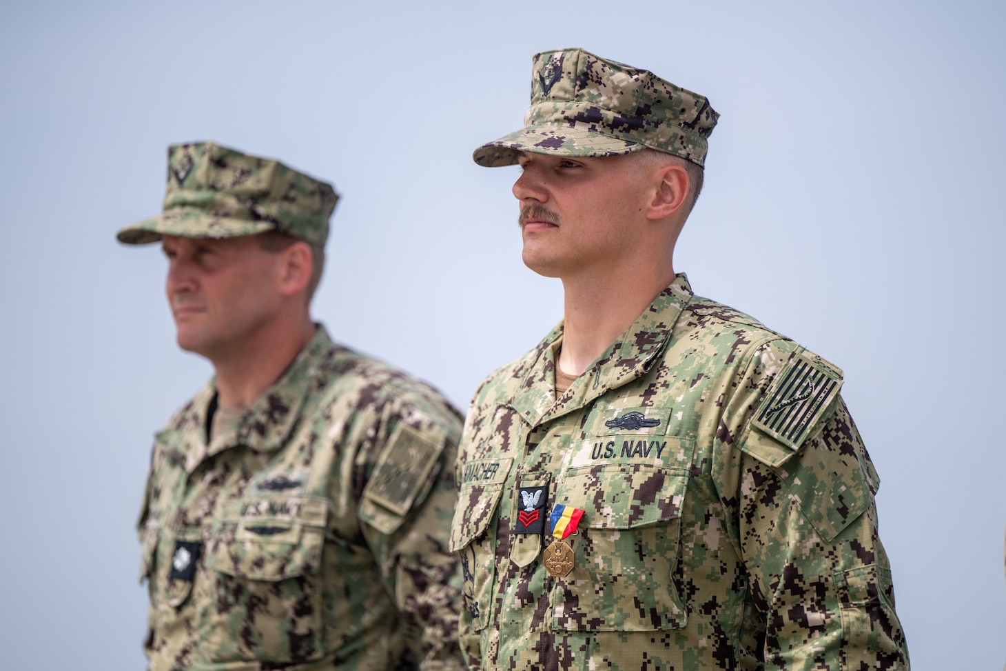 Utilitiesman 1st Class Steven Schumacher shakes the hand of Rear Adm. Dean VanderLey, commander, Naval Facilities Engineering Systems Command, at the Silver Strand Training Complex in San Diego.